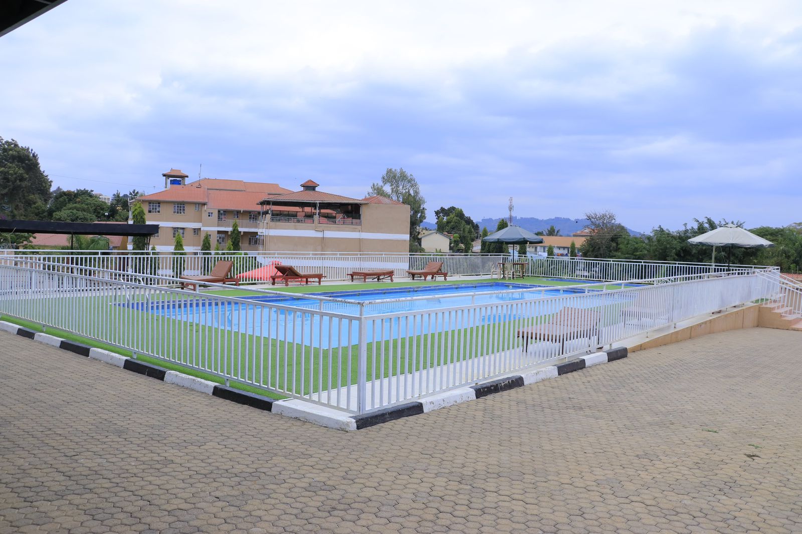 Pool area exterior view with safety fence